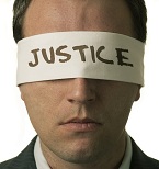 justice-covering-mans-eyes-dreamstime_13431077-cropped-143x154